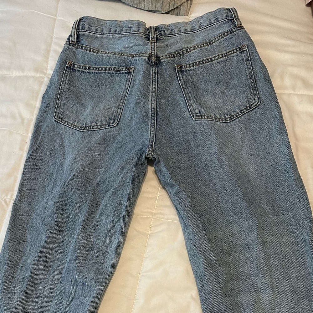 Medium wash petite button up crossover jeans.